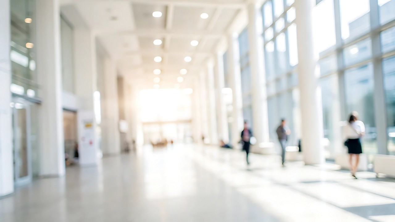 Business people walking in blurred background of modern office space bright environment