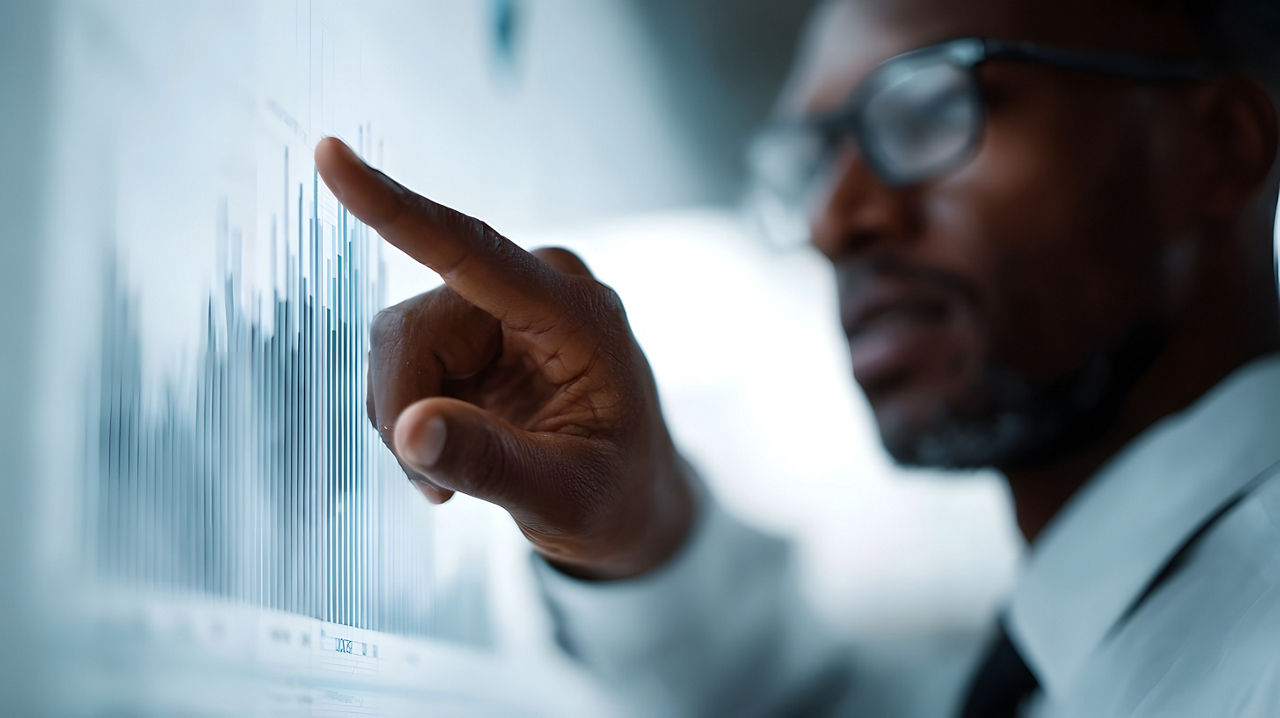 Person analyzing data representing Growth Acceleration, Corporate Strategy Advisory | DXC Technology