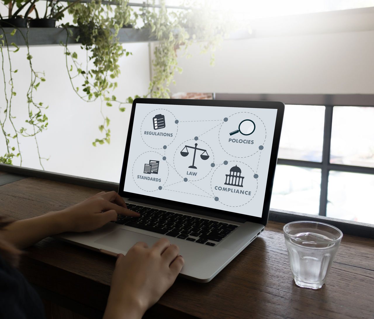 Laptop screen putting risk in context of law, compliance, regulations, Software Asset Management | DXC Technology