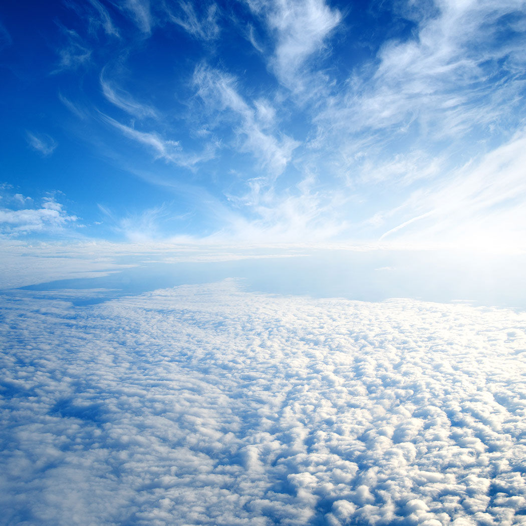 a field of fluffy clouds and bright sky, Oracle | DXC Technology
