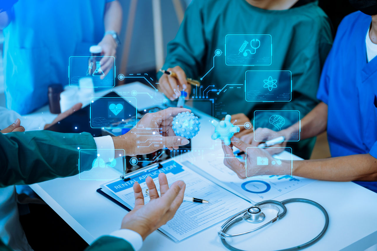 Medical technology, doctor use AI robots for diagnosis and increasing accuracy patient treatment in future. doctor hand working with tablet, computer with his team Medical research to improve patient health. | DXC Technology 