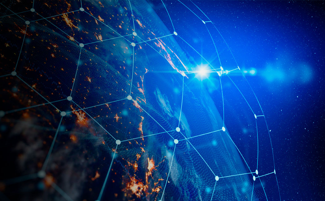 Earth at night with blue hexagonal mesh overlay and rising sun on horizon, Applications Modernization | DXC Technology