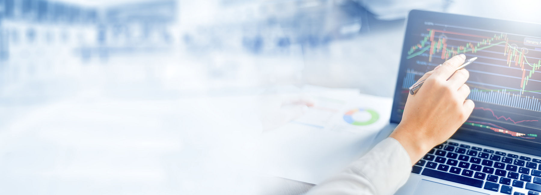 Person analyzing financial trading chart on laptop, Finance & Accounting | DXC Technology 