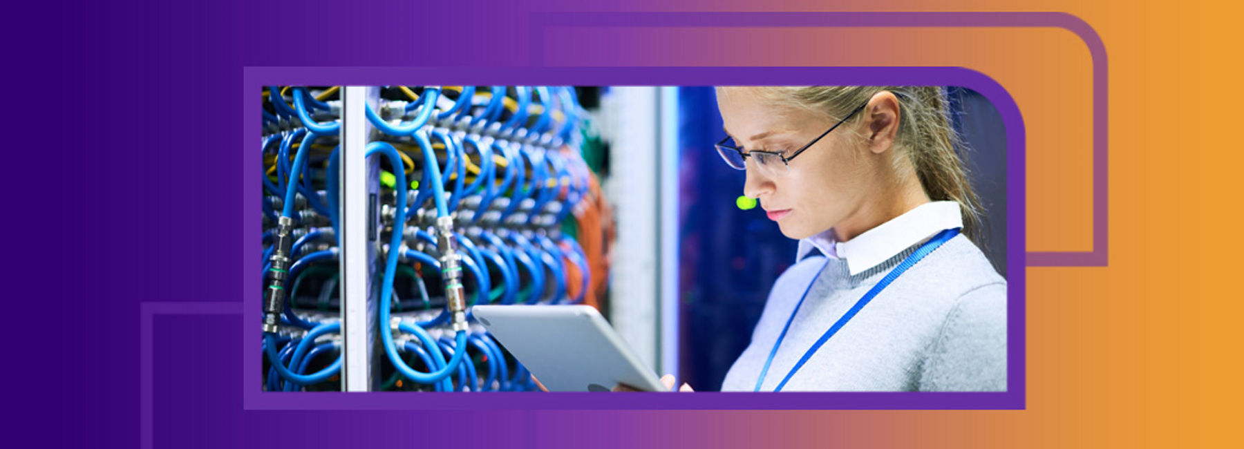 IT worker holding tablet reviewing mainframe operations, Managed Mainframe Services | DXC Technology | DXC Technology