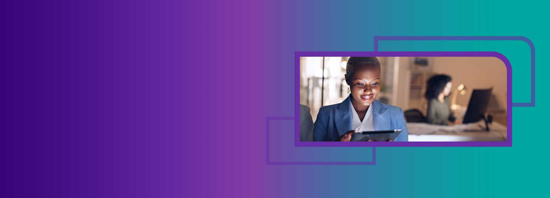 Woman working on tablet stands in foreground, while another woman works at desk behind her, Site Support | DXC Technology 