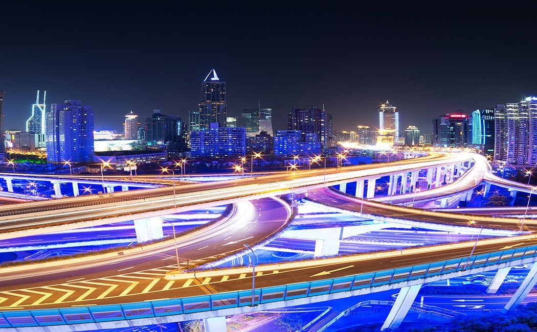 illuminated traffic on elevated expressway, Cloud & Infrastructure | DXC Technology
