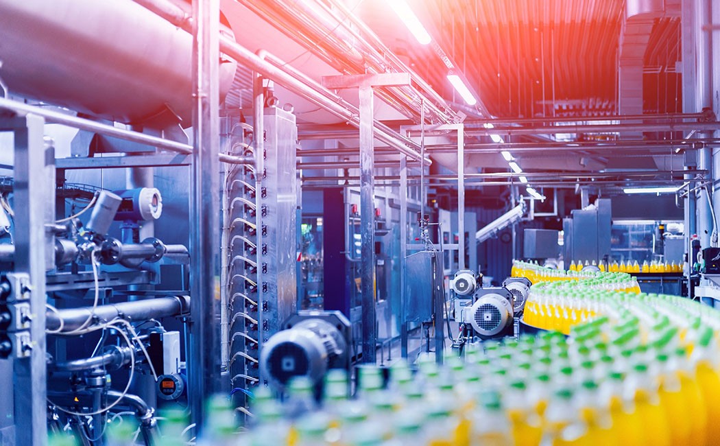 Beverage factory interior. Conveyor with bottles for juice or water. Modern equipments