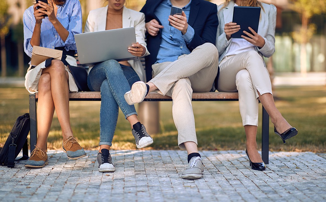 Group of businesspeople having casual meeting in park - concept