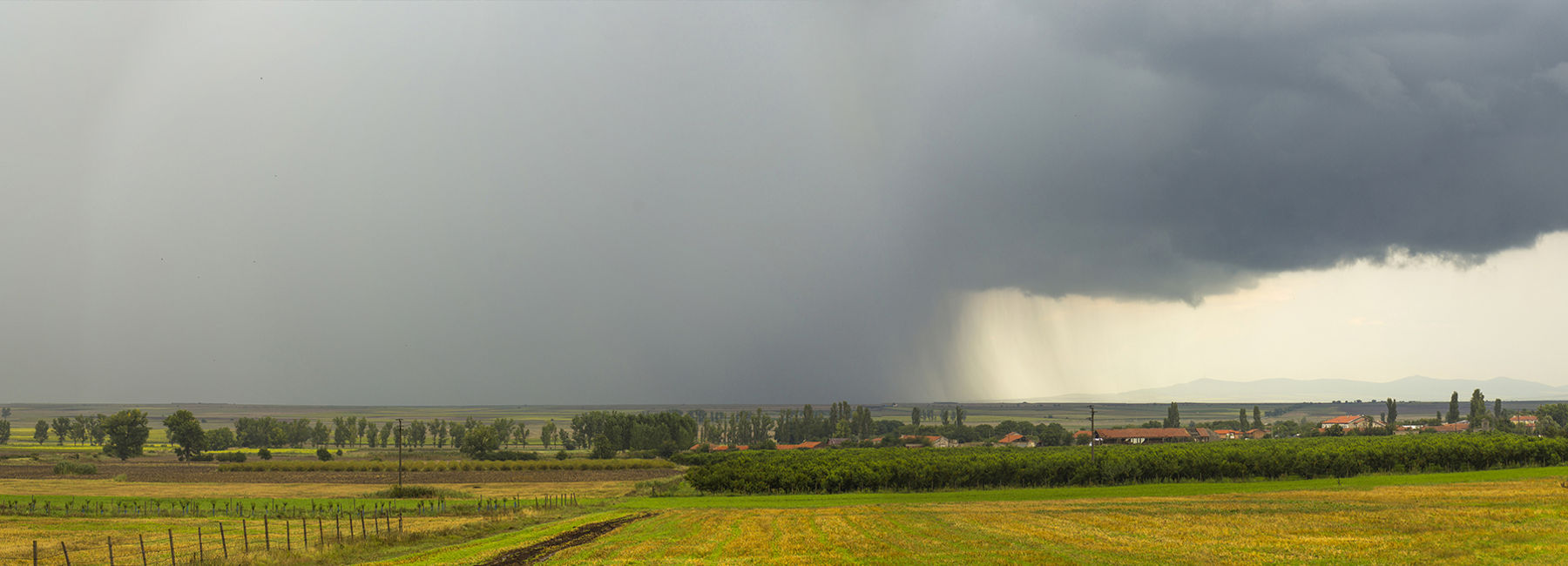 rainstorm in countryside, Assure suite for property and casualty | DXC Technology