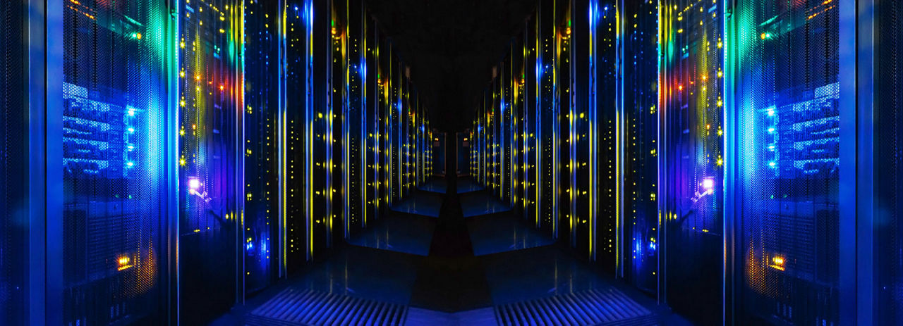 Aisle view of data center, Mainframe Modernization | DXC Technology Insights