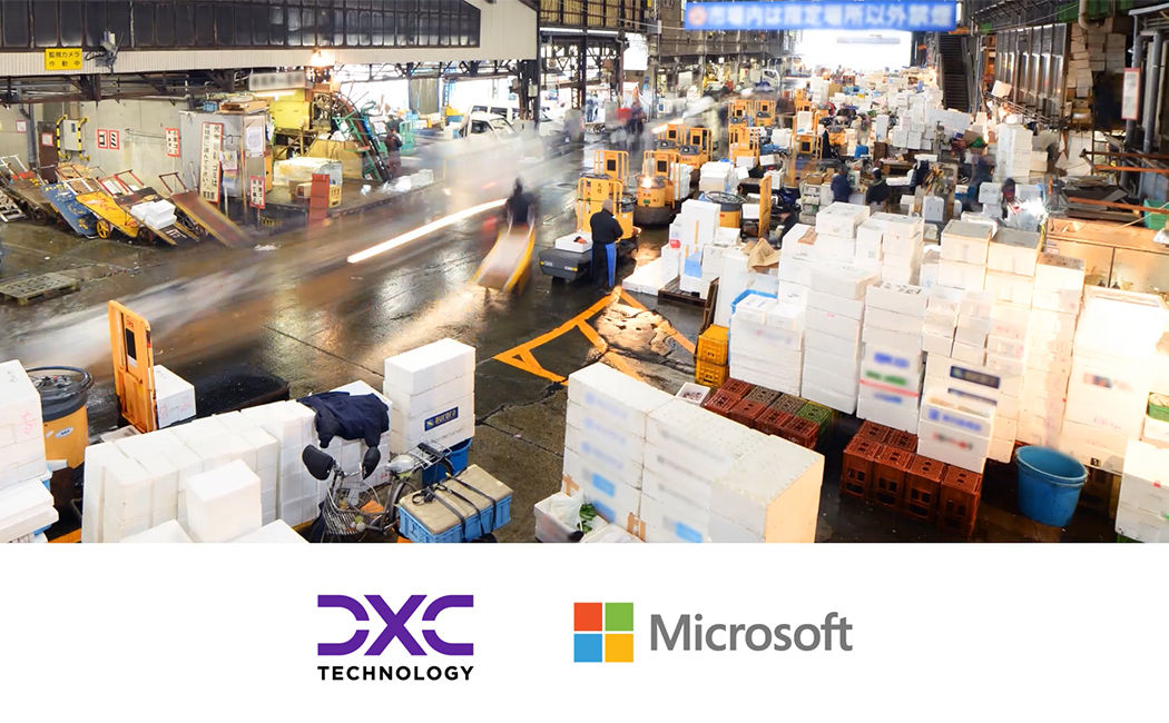 Still image from partnership video, view of bustling packing bay with boxes and forklift dollies, Microsoft | DXC Technology