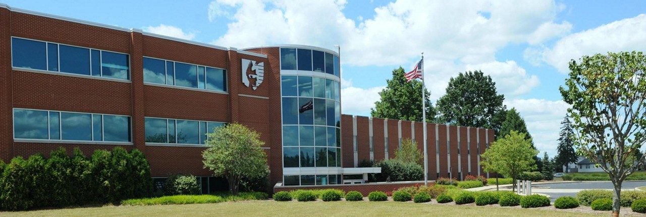 windows of an office building, Ohio Mutual Insurance Group Assure suite for property and casualty | DXC Technology Customer Story