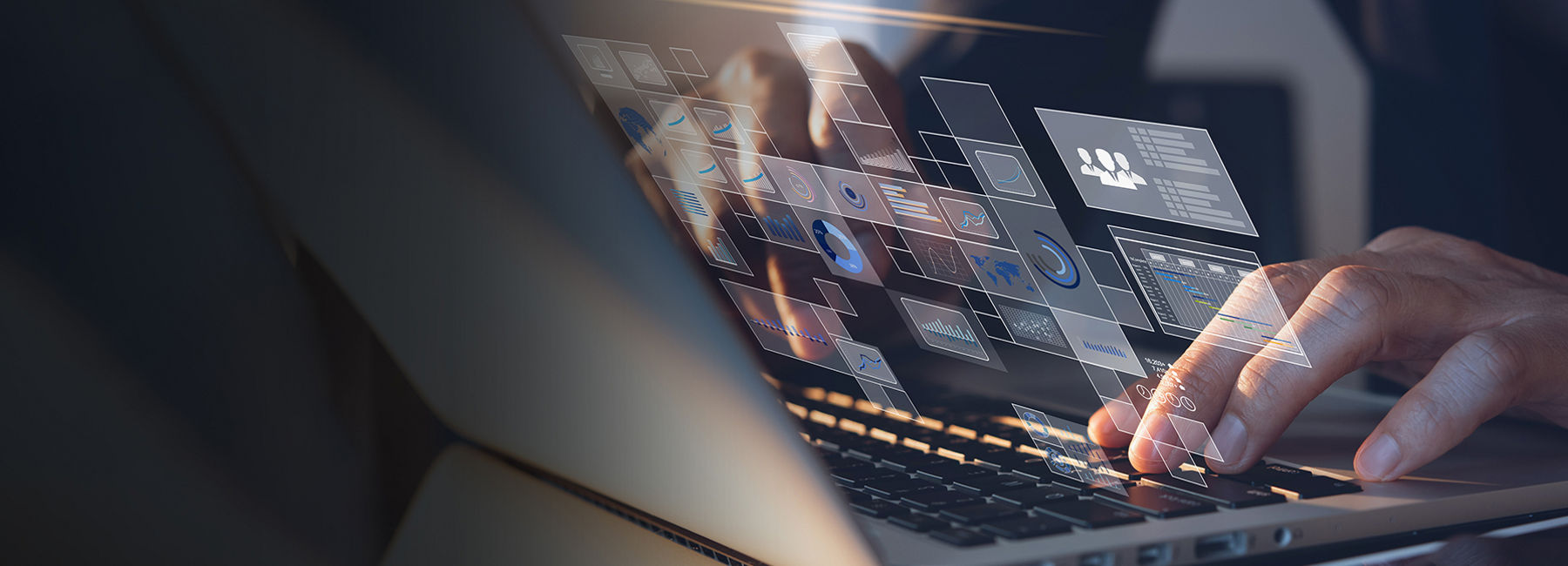 Hands typing on a laptop keyboard with digital data overlay, Platform X, data-driven intelligence | DXC Technology