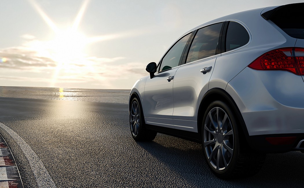 3d car sedan rides on the road to meet the sun, concept 3d render for advertising auto products