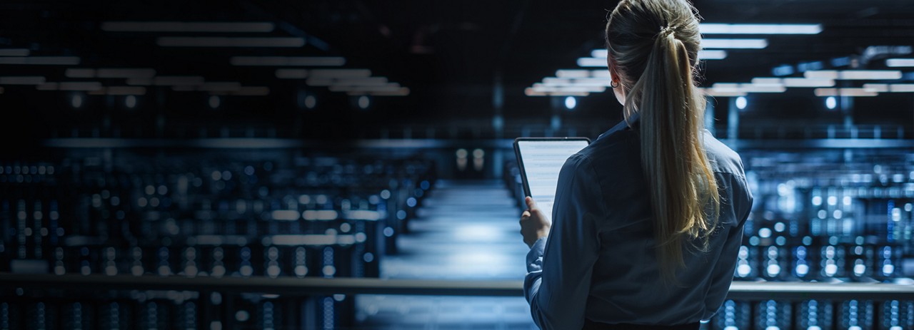 woman overlooking data center, Cloud & Infrastructure | DXC Technology