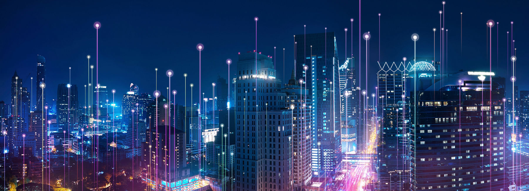 city at night with digital connections | DXC Technology Insights