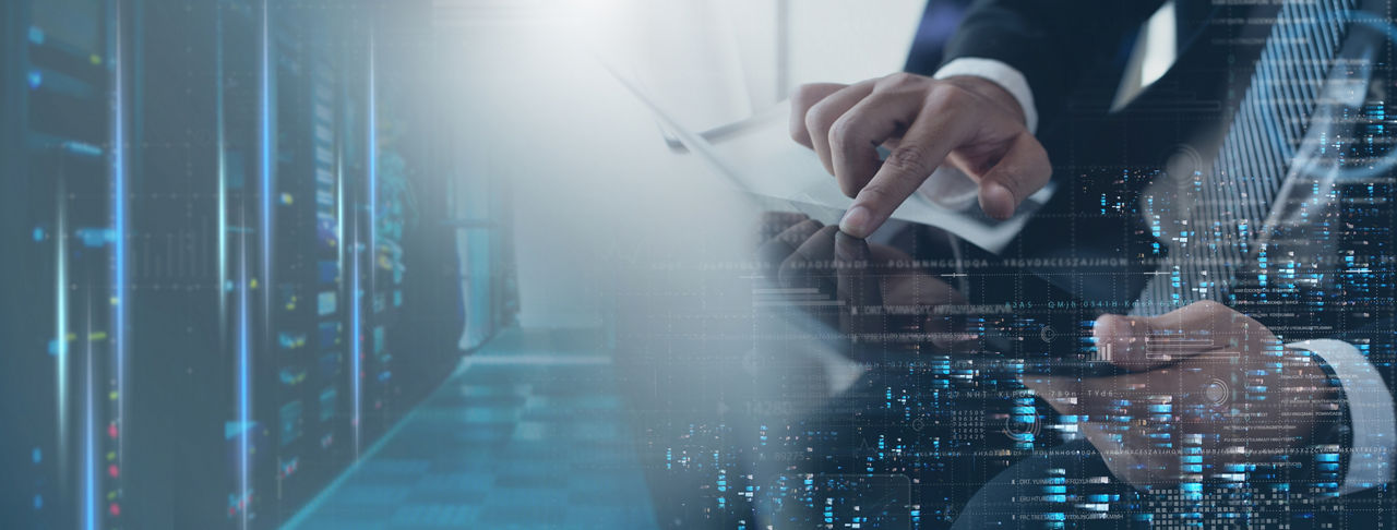 Businessman using digital tablet representing Reinsurance | DXC Technology