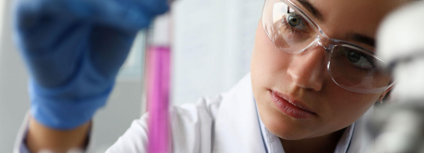 Medical pro observing fluid in tube - AI Solutions in Healthcare | DXC Technology Insights