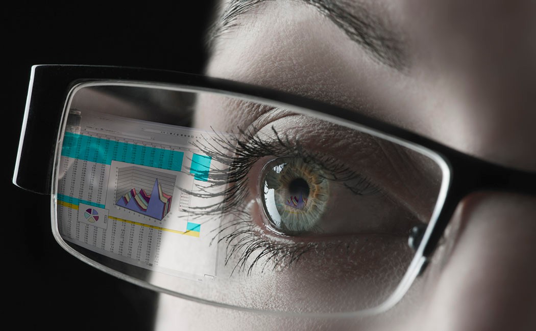 woman with view of chart in her eyeglasses, Cloud & Infrastructure | DXC Technology customer story