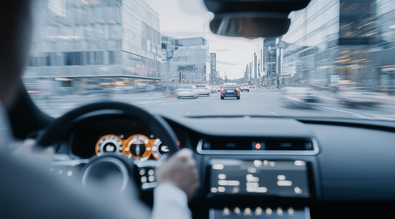 Connected car driving on city roads, connected mobility solutions | DXC Technology