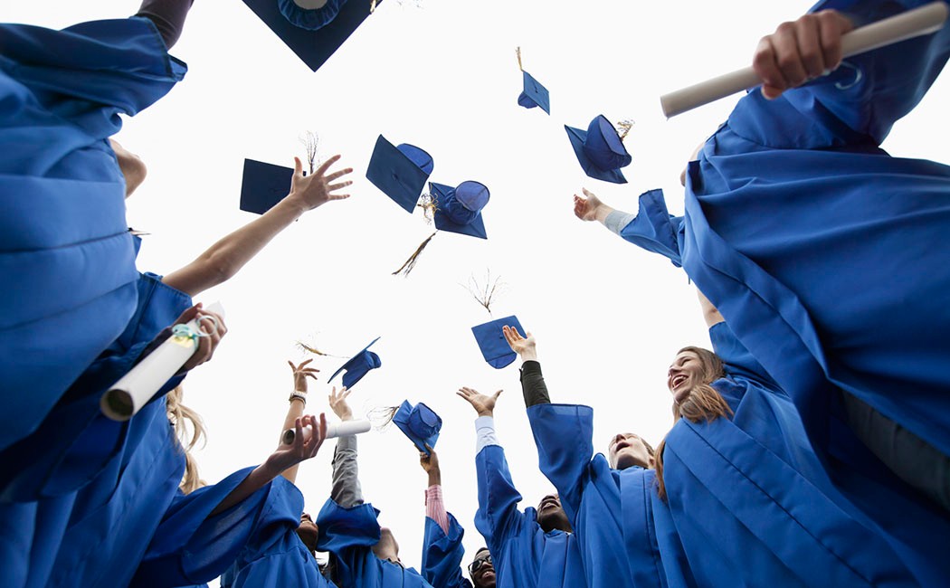 26 Apr 2012 --- Graduates throwing caps in the air. --- Image by © Hero/Corbis