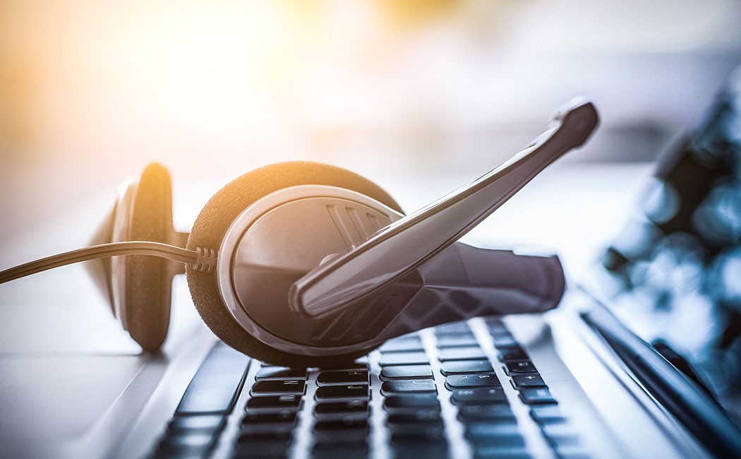 headset on laptop, Contact Center Experience | DXC Technology