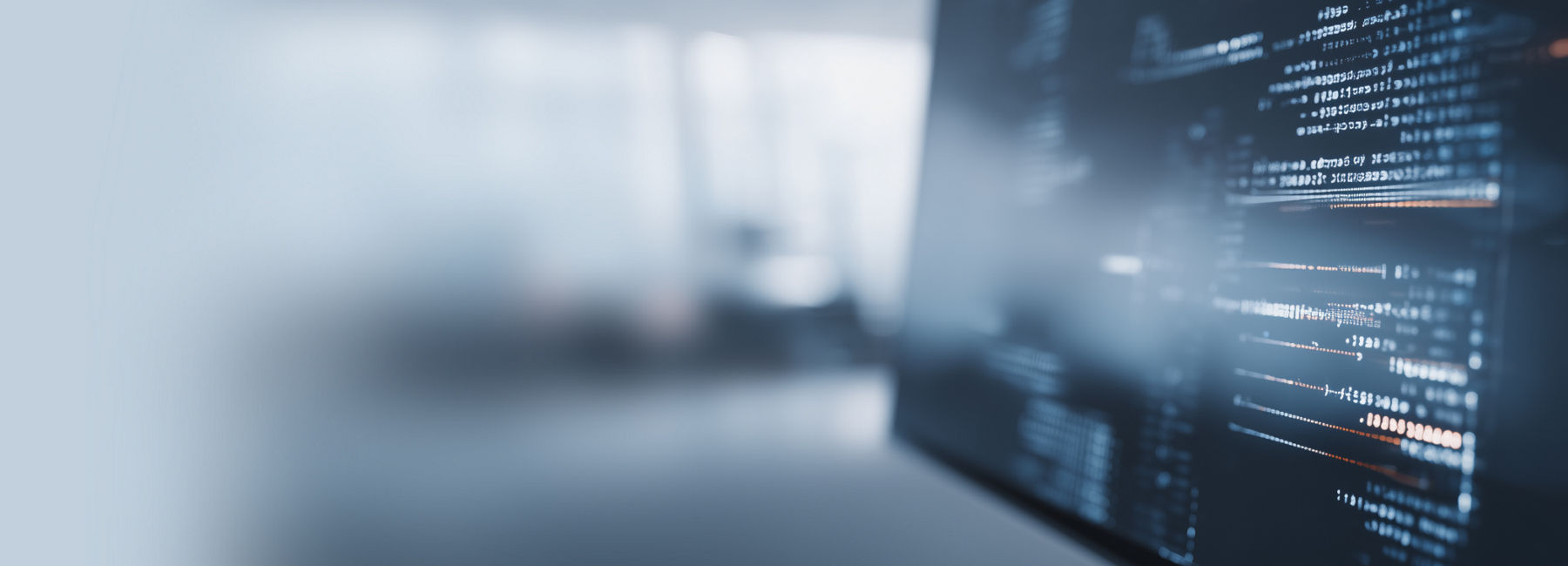 Man analyzing data on screen, highlighting Cyber Risk & Compliance for better decisions, Cybersecurity | DXC Technology Services