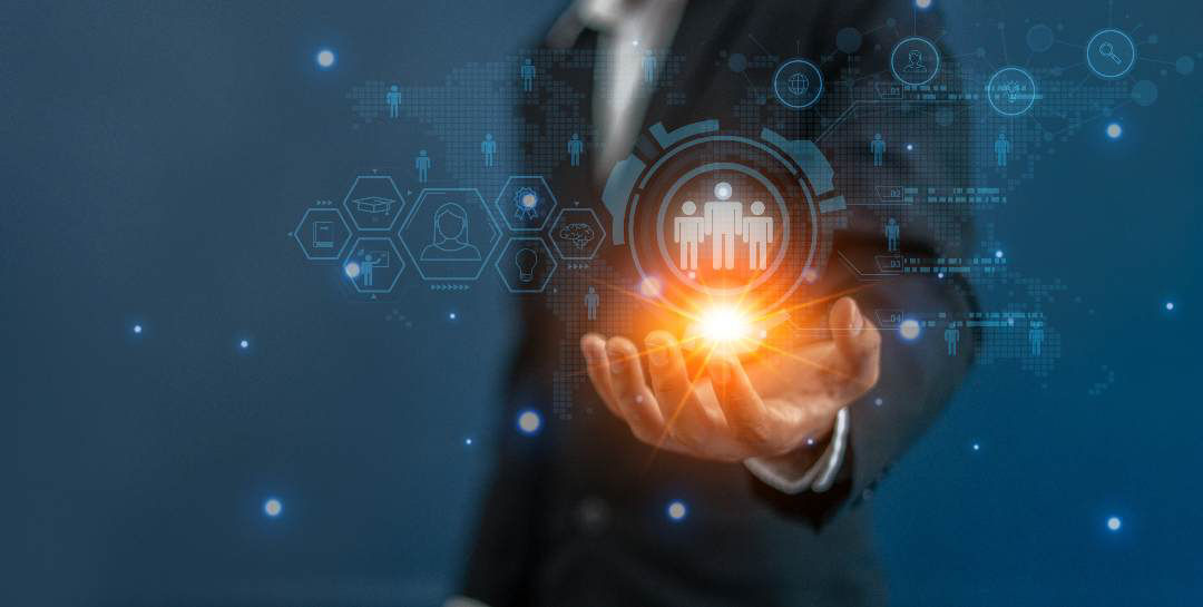 hand holding digital ball with people, Comprehensive support, Business process services: Life and wealth | DXC Technology