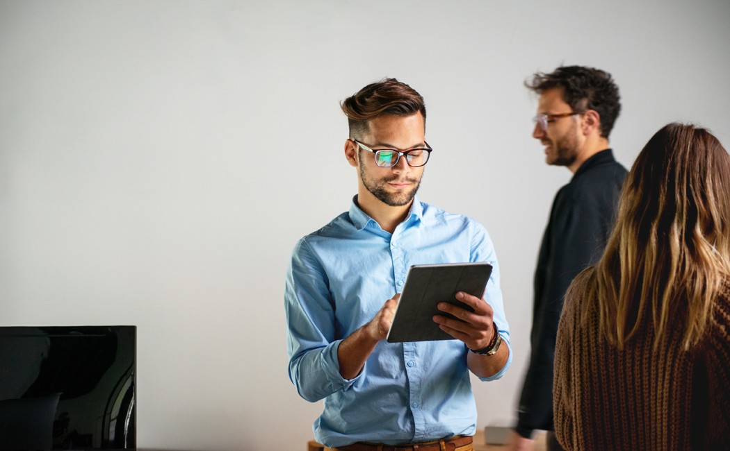 Hands typing on laptop keyboard - Managing Debt in the Insurance Industry | DXC Technology Insights