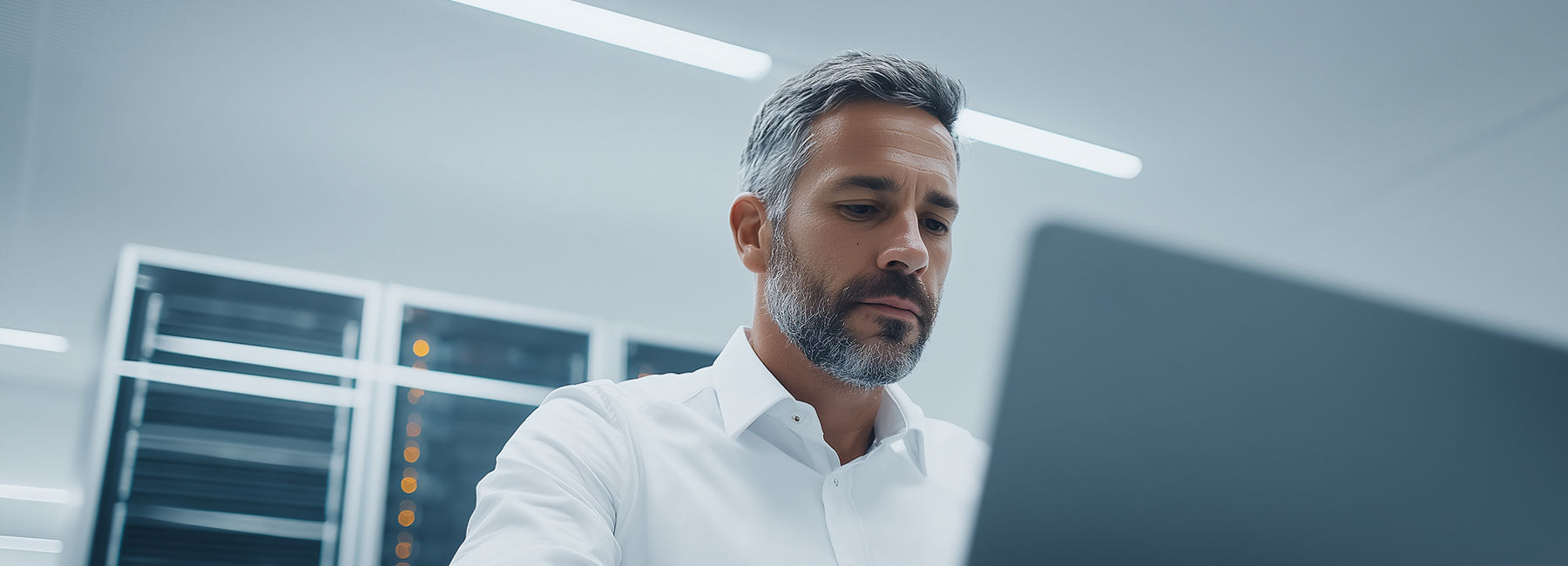 man working in a data center, Private AI for the Enterprise | DXC Technology