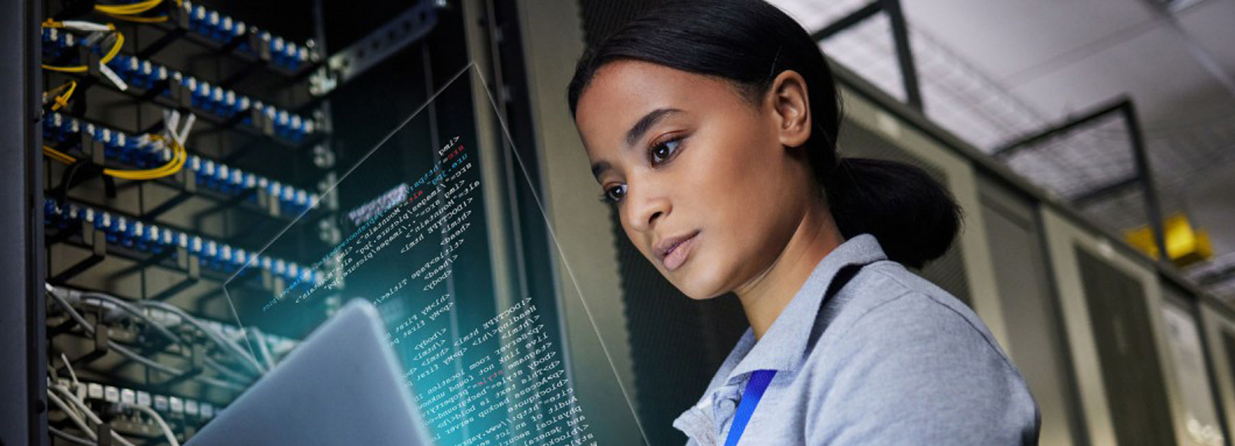 Woman working in data center, Protecting our clients during the largest IT outage in history | DXC Technology Insights