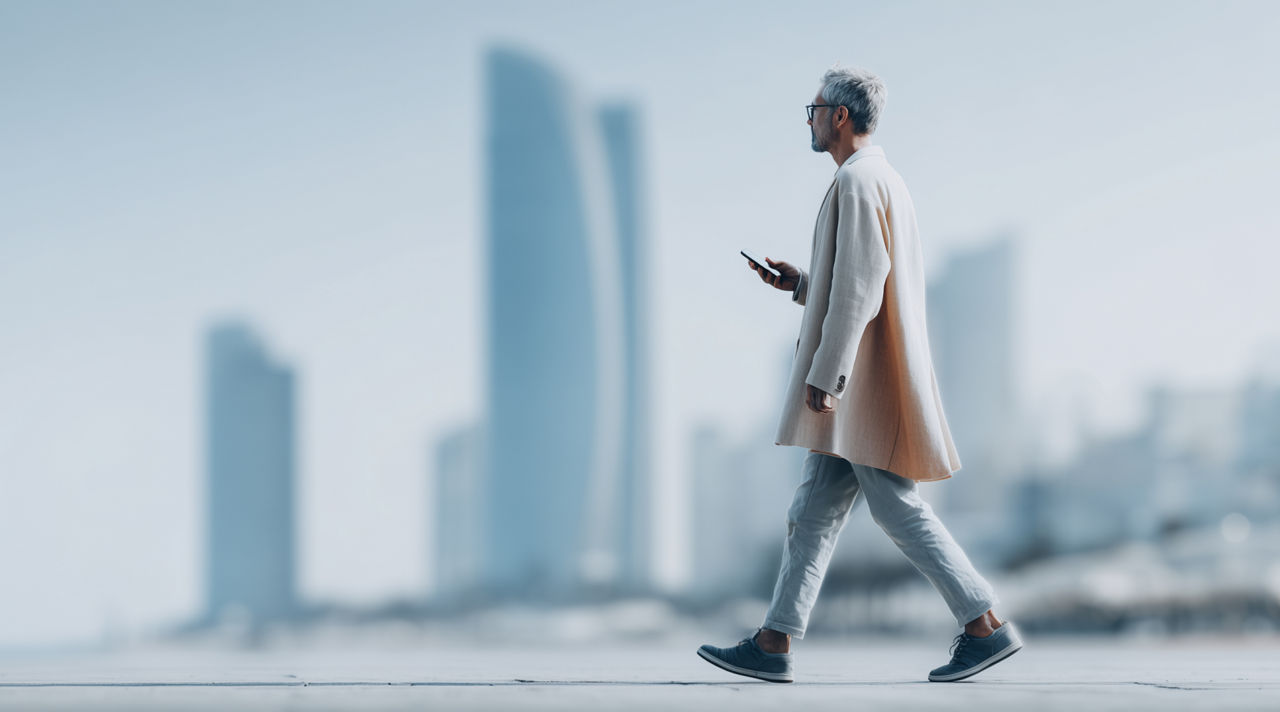 Man walking down the street, Software solutions defining the future of automotive | DXC Technology