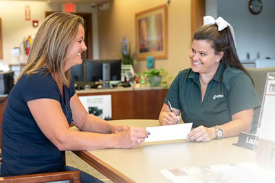 Banker and customer reviewing documents