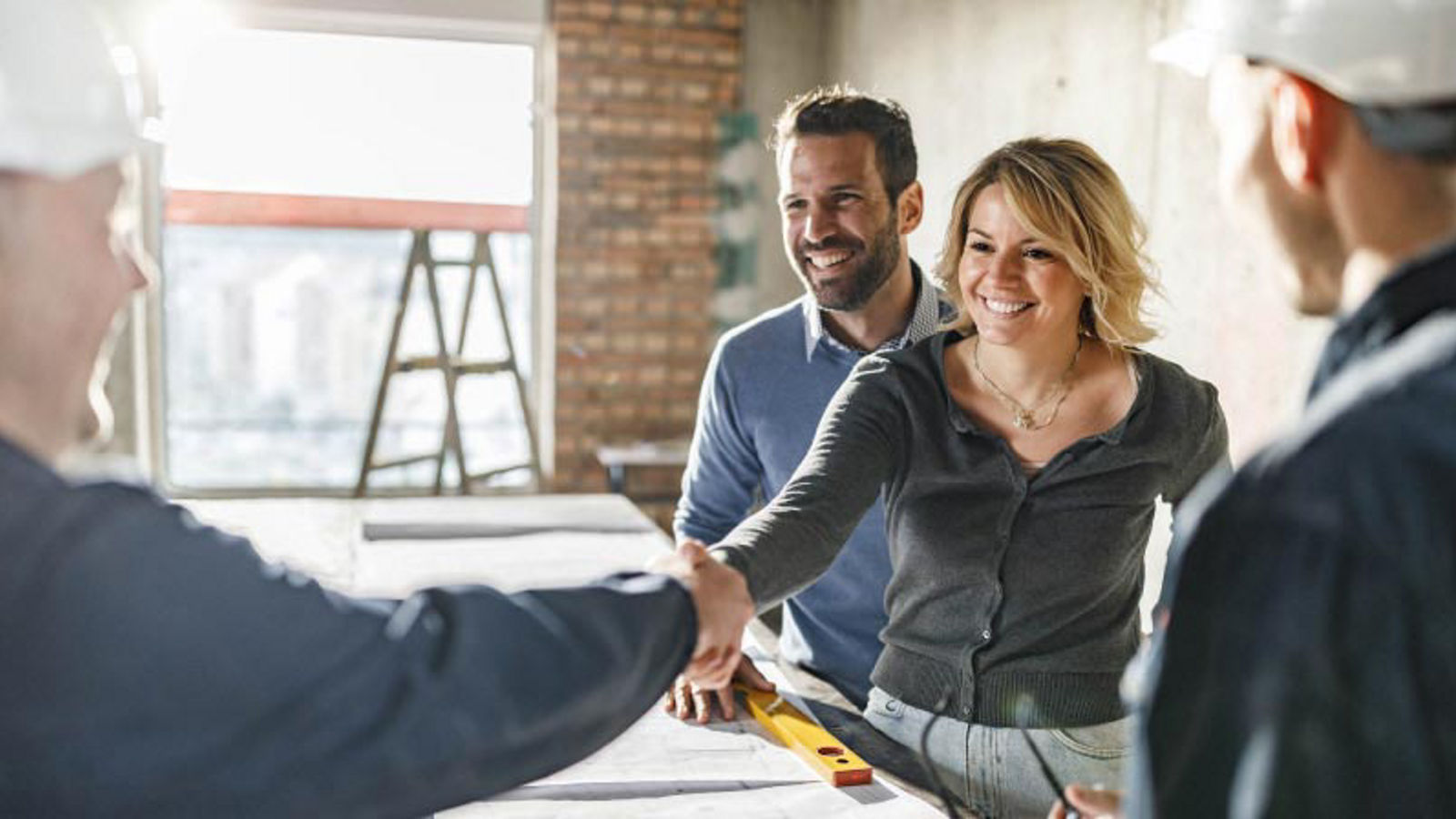 couple handshake construction loan