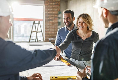 couple handshake construction loan