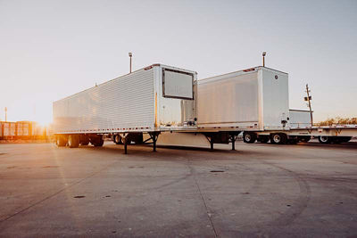 Group of tractor trailers in a parking lot