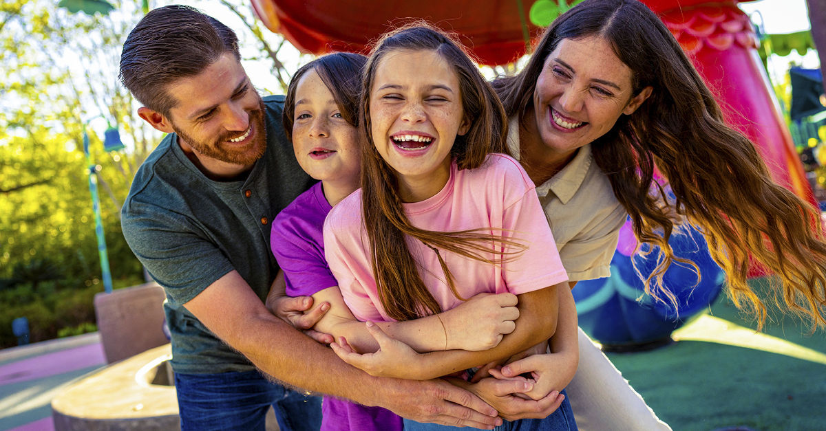 Family hugging and laughing