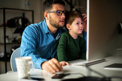 Man with Son on Computer
