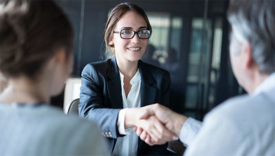 advisor shaking hands with client