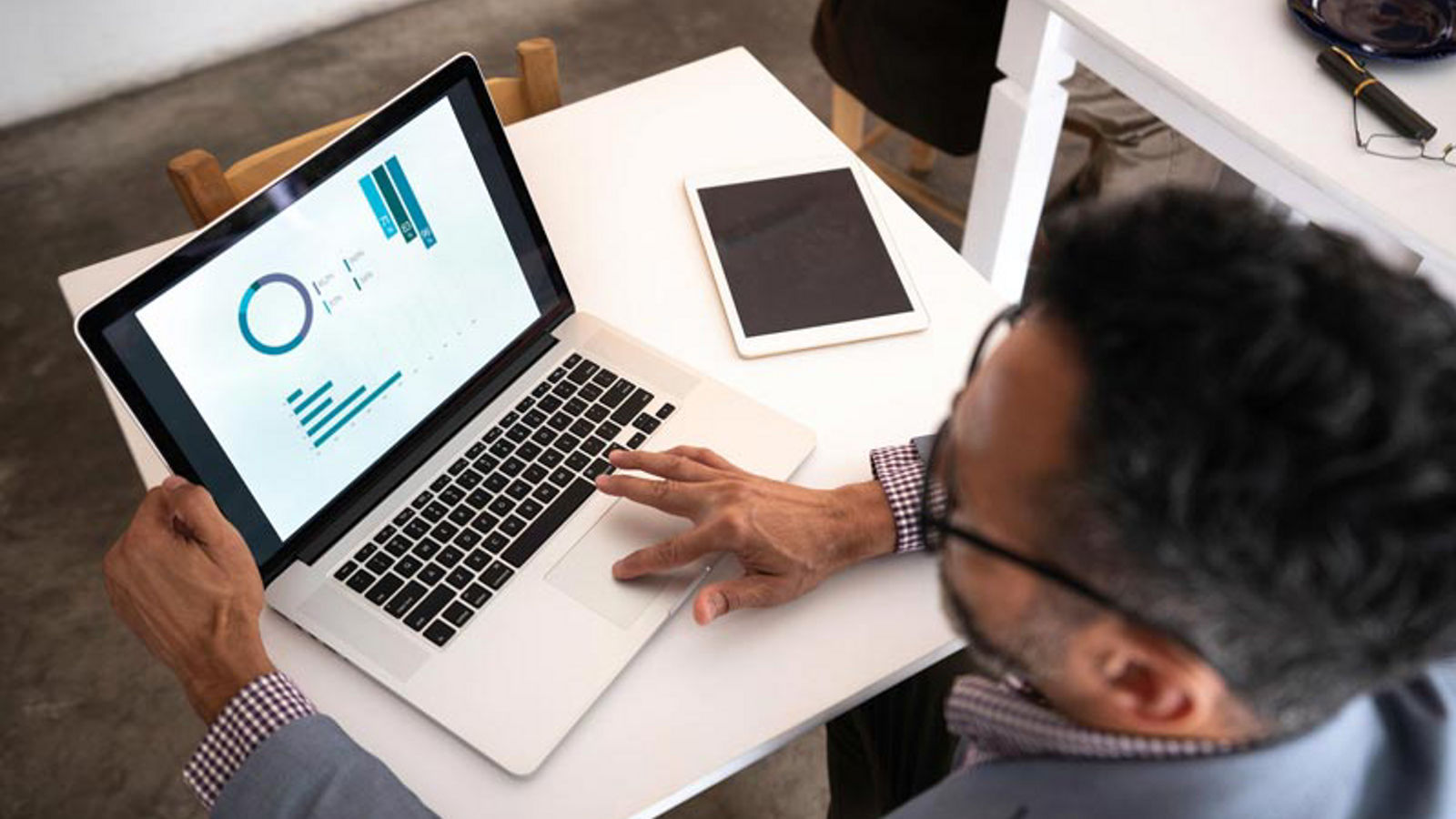 Man working at is office on his laptop