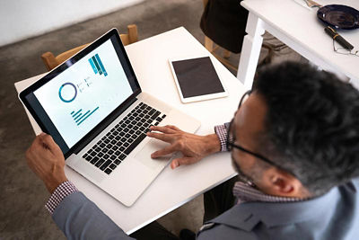 Man working at is office on his laptop