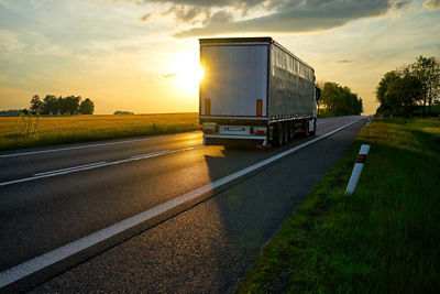Semi driving at sunset
