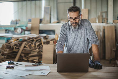 Man working looking at laptop