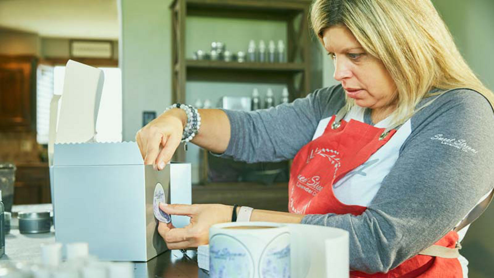Woman working at her coffee shop