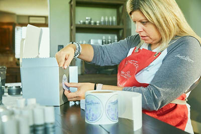 Woman working at her coffee shop
