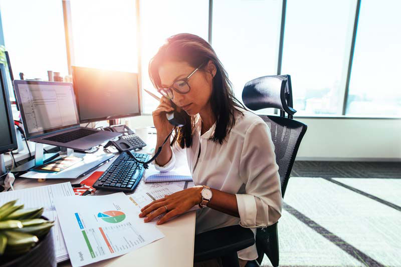 Woman on the phone in her office