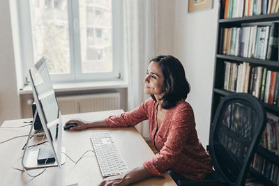 Woman working at home on her computer