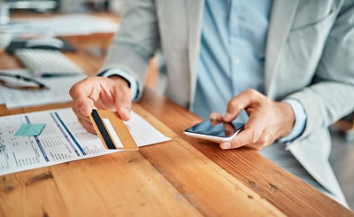 Man buying something on his smartphone with his credit card