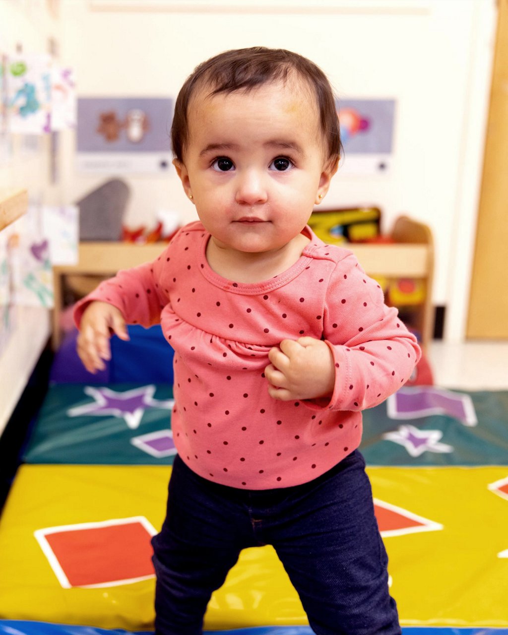 Infant dancing in a preschool classroom