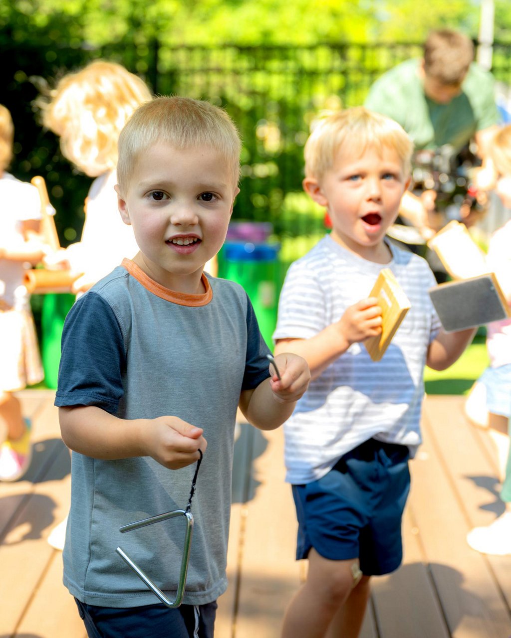 Two children playing musical instruments 